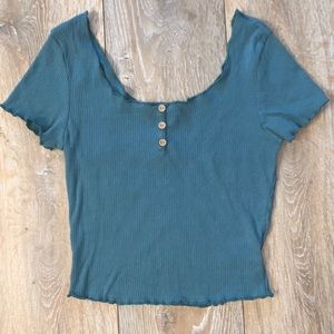 Green ruffle edged tee with buttons